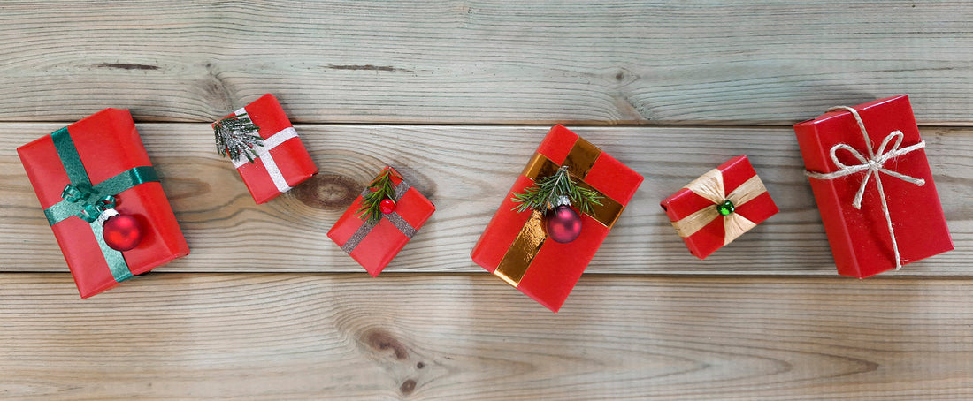 A row of wrapped gifts in red & gold