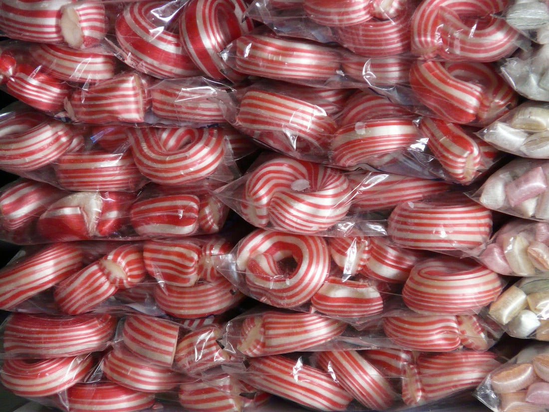 a pile of red/white wrapped candies